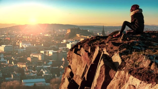 A Girl Overlooking The Beautiful Edinburgh Skyline And Castle During A Winter Sunrise
