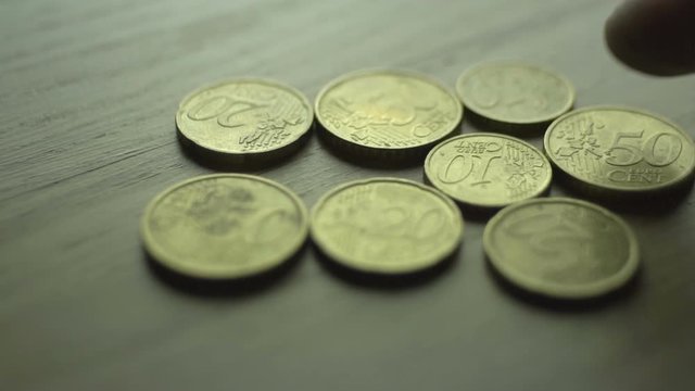 Close Up of Hands Counting Euro Cents