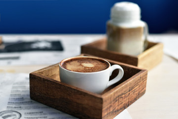 Cup of coffee on the table in cafe