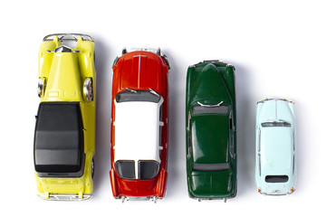 four toys retro cars isolated on white background