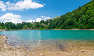 mountain lake in a valley in Georgia on a summer day