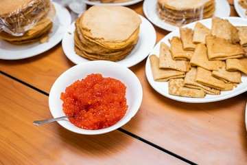pancakes for Shrovetide. pancakes with red caviar. Russian traditions.