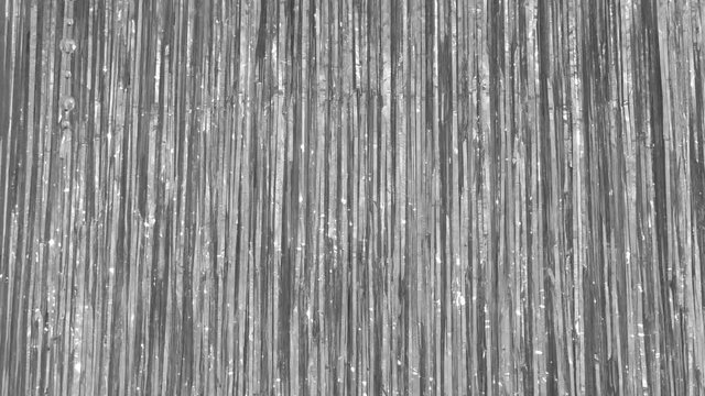 Background Christmas sparkling tinsel. Long sequins new Year decoration.