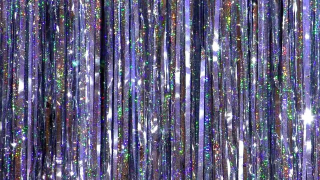 Background Christmas sparkling tinsel. Long sequins new Year decoration.