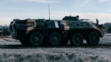 Armored personnel carrier in a combat position in winter