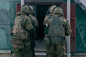 Obraz premium The storming of the premises at the special forces training ground with shields