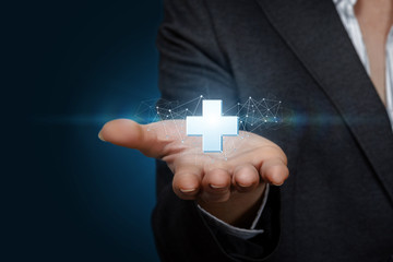 Hand of a businesswoman offer positive thing represented by plus sign.