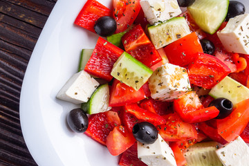 greek salad on dark wooden rustic background
