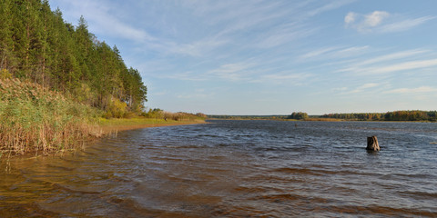 Autumn pike fishing on the Rybinsk reservoir, beautiful panorama.