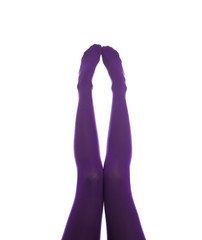 Woman wearing purple tights on white background, closeup of legs