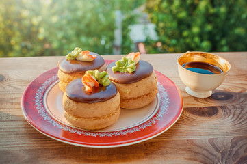 cake with coffee cup on green blur background