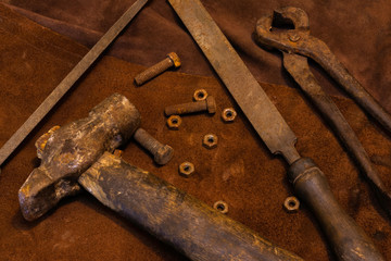 Rusty tools on leather