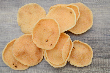 Prawn Crackers (Krupuk) on wooden background