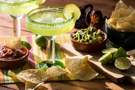 Margaritas with nachos and guacamole.