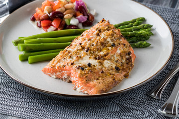 Salmon with asparagus and bean salad.