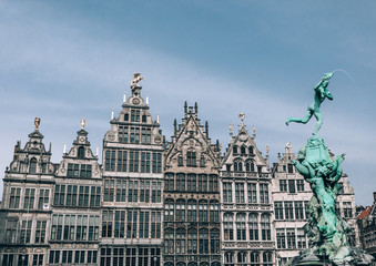 Fototapeta na wymiar A row of Famous Antwerp historic building, and Brabo fountain sculpture.