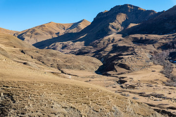 Distant view stone remains of old abandoned balkar village in North Caucasus