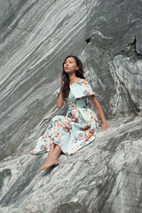 Young woman in long dress