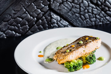 roasted salmon with vegetables and sauce