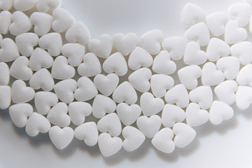 Tablets. Candies. Heart shaped pills. A lot of little hearts.