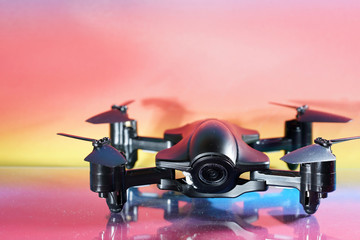 Quadrocopter also called drone photographed in the studio and faked flight