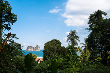 Fototapeta na wymiar Panoramic view of a blue scenery of an exotic beach in Thailand Andaman sea. Adventure in the jungle and travel concept .Scenic landscape in paradisiacal islands. Holiday vacation background concept.