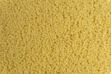 Couscous filling frame making a food texture, background.
