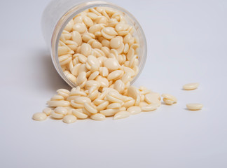 spa wax for depilation in granular form on the white background