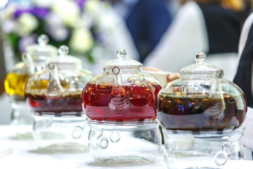 Obraz na płótnie Canvas Transparent glass teapots with brewed tea