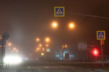 Traffic at an intersection in the fog