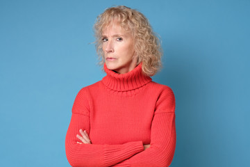 Blonde caucasian mature woman has serious look, listens interlocutor very attentively. Mother...
