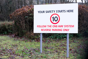 Reverse parking one way system in staff car park sign
