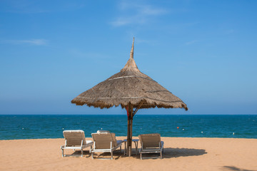 Sun beds and an umbrella on the beach