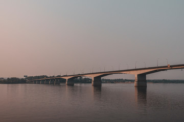 Fototapeta na wymiar Bridge over the Kama river on sunset