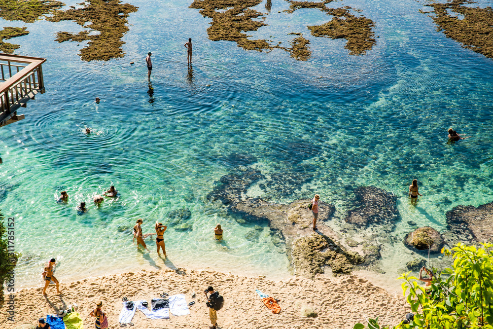 Wall mural a beautiful view of uluwatu beach in bali, indonesia.