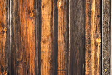 Obraz premium fragment of the gate from old wooden planks in natural color