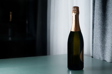 Champagne bottle on glass table