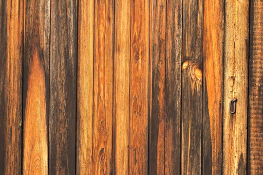 fragment of the gate from old wooden planks in natural color