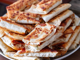 Cottage cheese rolls with a crisp on a plate close-up