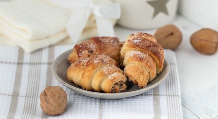 Naklejka na ściany i meble Homemade Christmas croissants with nut filling