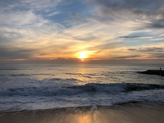 Obraz premium Couché de soleil sur la plage de Costa da Caparica, Portugal 