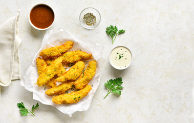 Crispy fried breaded chicken breast strips