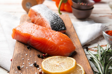 Raw salmon fillet on table