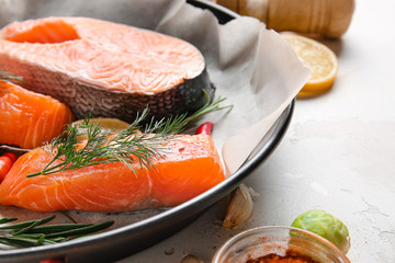 Fresh raw salmon in wok, closeup