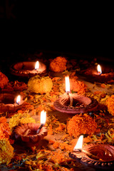 Clay diya lamps lit during diwali celebration. Greetings Card Design Indian Hindu Light Festival called Diwali
