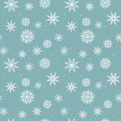 Seamless pattern with white snowflakes