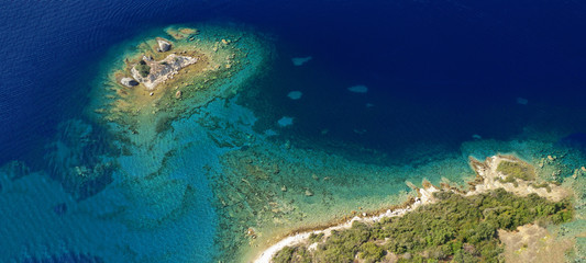 Aerial drone ultra wide photo of beautiful exotic paradise rocky turquoise beach in Caribbean island destination