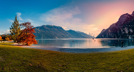 Beautiful and colorful autumn in Riva del Garda, Garda lake surrounded by mountains, Trentino Alto Adige region, Lago di garda, italy