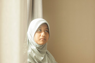 Asian Teenage Muslim Girl Looking Up and Thinking