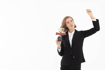 Portrait of successful business woman hoding trophy on white isolated background.